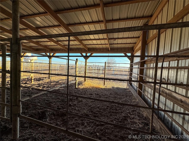 view of stable featuring a rural view