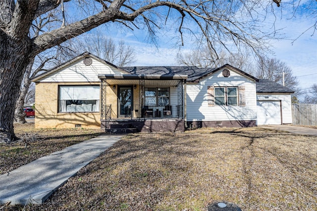 ranch-style house with a porch and a garage