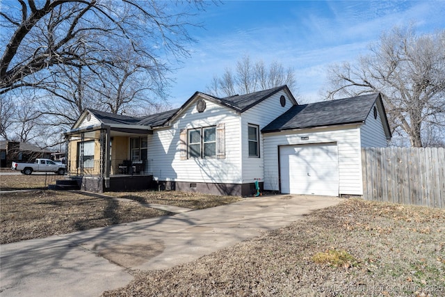 view of home's exterior with a garage and covered porch