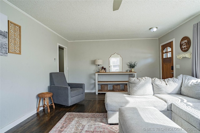 living room featuring crown molding, dark hardwood / wood-style floors, and a textured ceiling