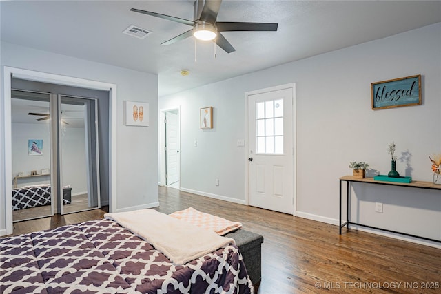 bedroom featuring ceiling fan and dark hardwood / wood-style floors
