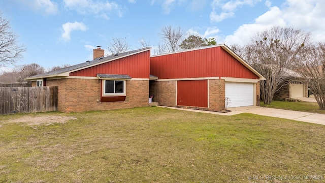 view of front of house with a garage and a front yard