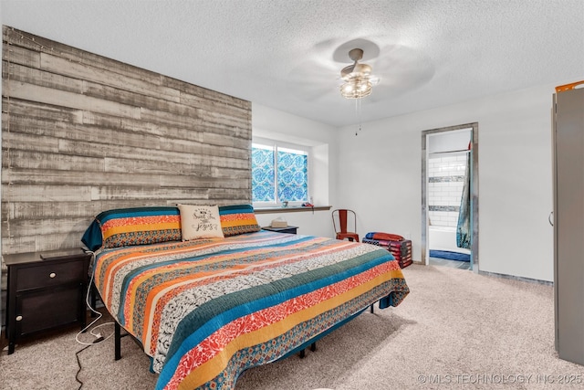 bedroom featuring ceiling fan, light carpet, and a textured ceiling