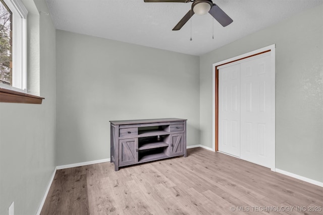 unfurnished bedroom featuring a closet, ceiling fan, and light hardwood / wood-style flooring