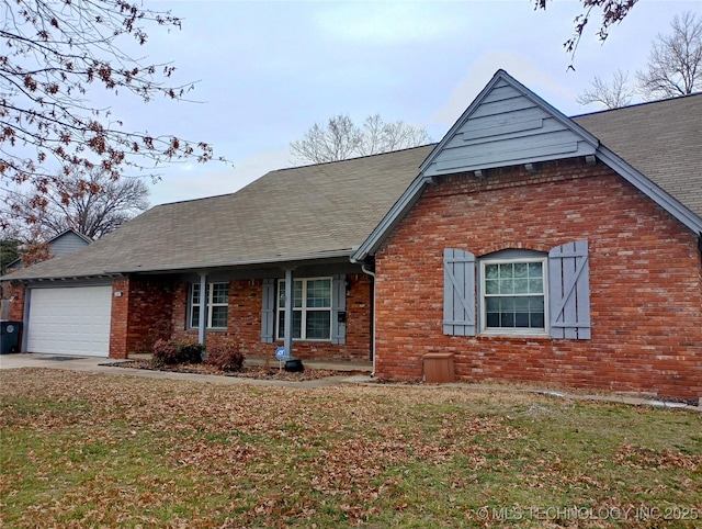 view of front of house featuring a garage and a front lawn