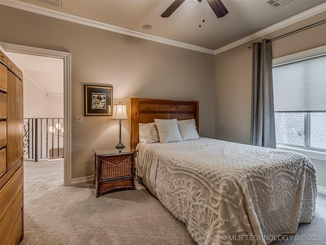 bedroom featuring carpet floors, ornamental molding, and ceiling fan
