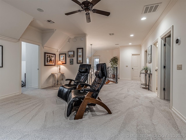 sitting room with light carpet, crown molding, and ceiling fan