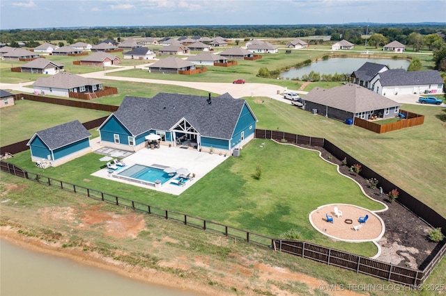 birds eye view of property with a water view