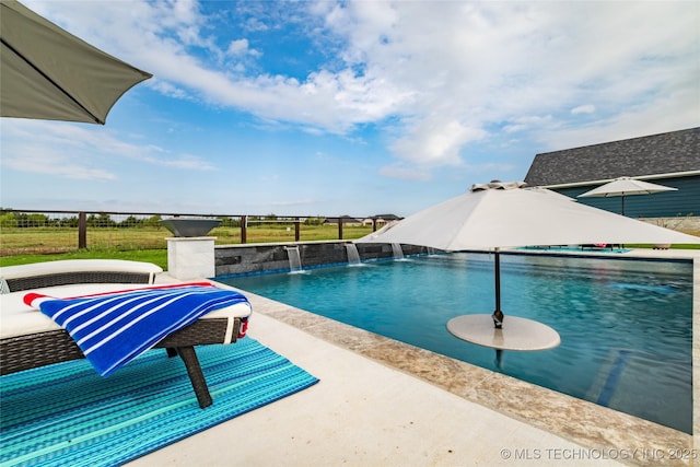 view of swimming pool featuring pool water feature and a patio area