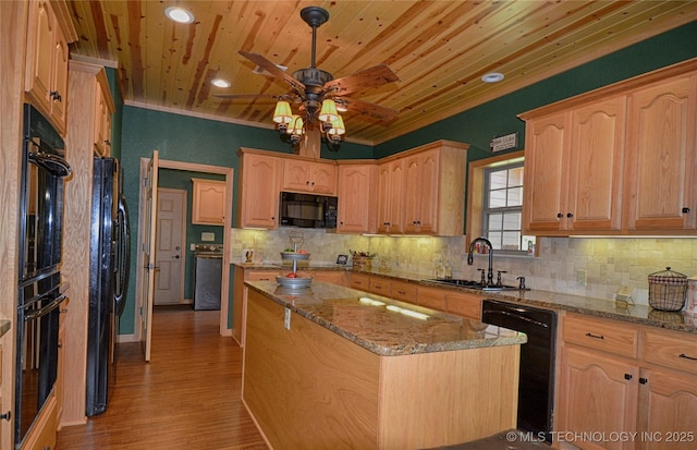 kitchen with sink, light stone counters, a center island, wooden ceiling, and black appliances