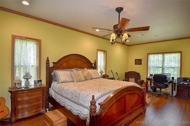 bedroom with ceiling fan, ornamental molding, and dark hardwood / wood-style floors