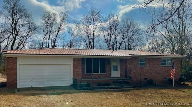 single story home featuring a garage and a front yard