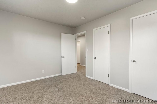 unfurnished bedroom featuring carpet flooring