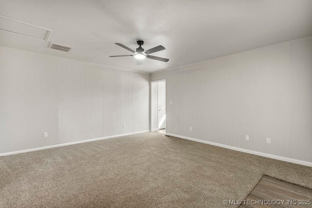 carpeted spare room with ceiling fan