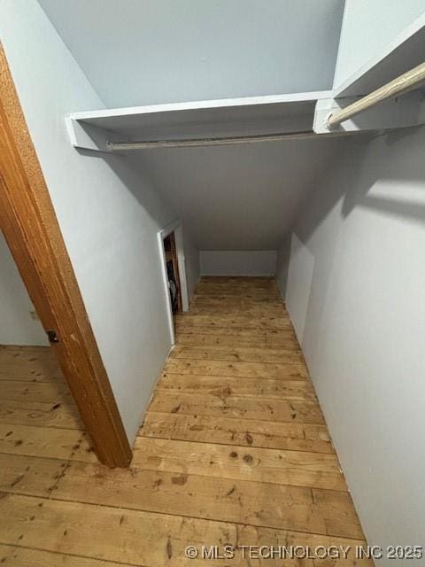 hallway with light hardwood / wood-style flooring