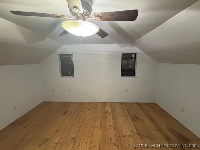 bonus room with ceiling fan, vaulted ceiling, and wood-type flooring