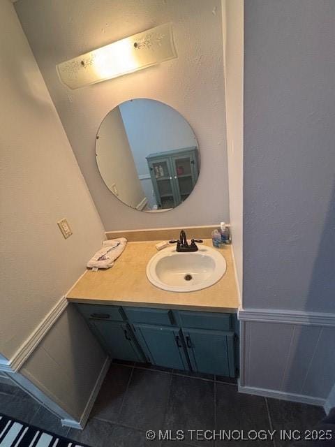 bathroom with vanity and tile patterned floors