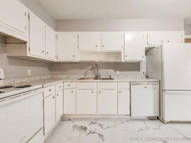 kitchen featuring white cabinetry, sink, and white appliances