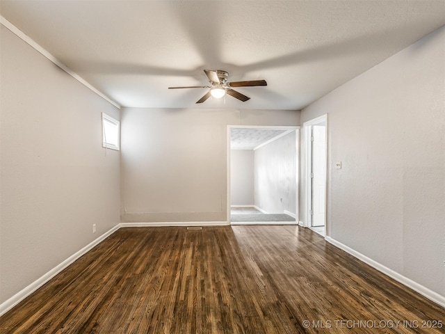 unfurnished room with a textured ceiling, dark hardwood / wood-style floors, and ceiling fan