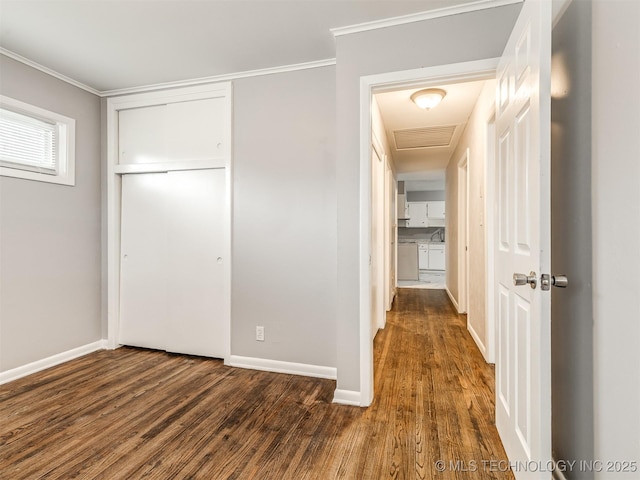 interior space with dark wood-type flooring and ornamental molding