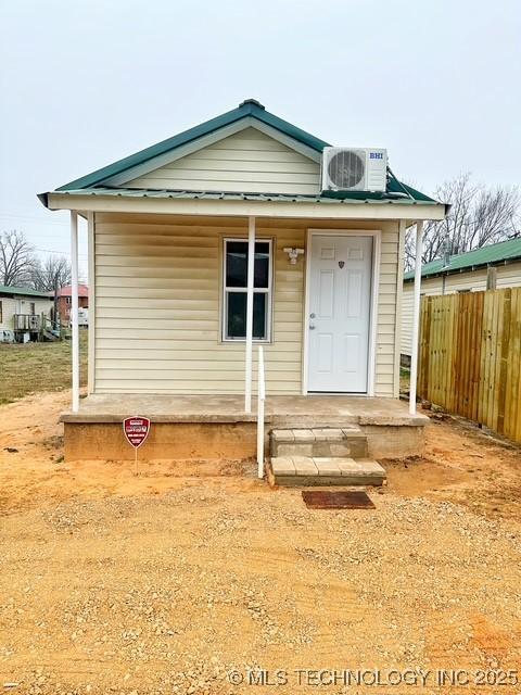 view of front of home featuring ac unit and central AC unit