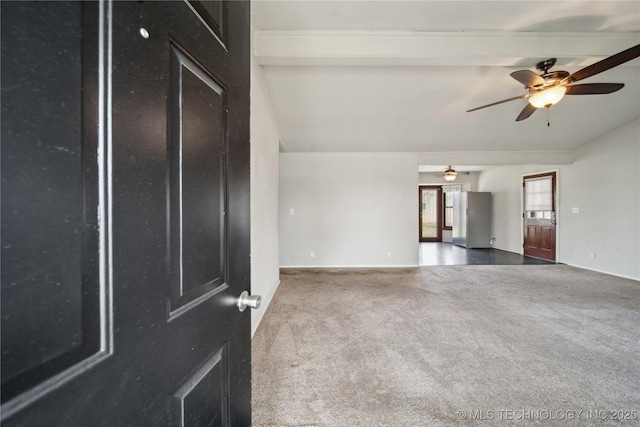 spare room with carpet and ceiling fan