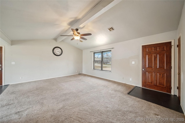 interior space with ceiling fan, vaulted ceiling with beams, and carpet