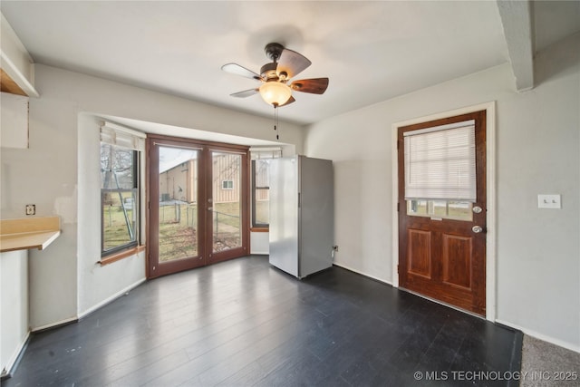 interior space featuring dark hardwood / wood-style flooring and ceiling fan