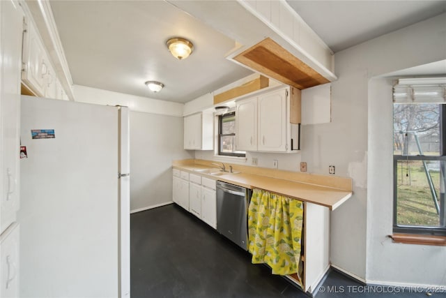 kitchen featuring white cabinets, white refrigerator, sink, and stainless steel dishwasher