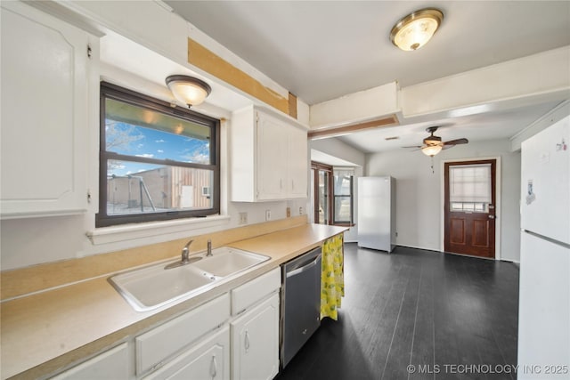 kitchen with dishwasher, white cabinets, white fridge, sink, and dark hardwood / wood-style floors