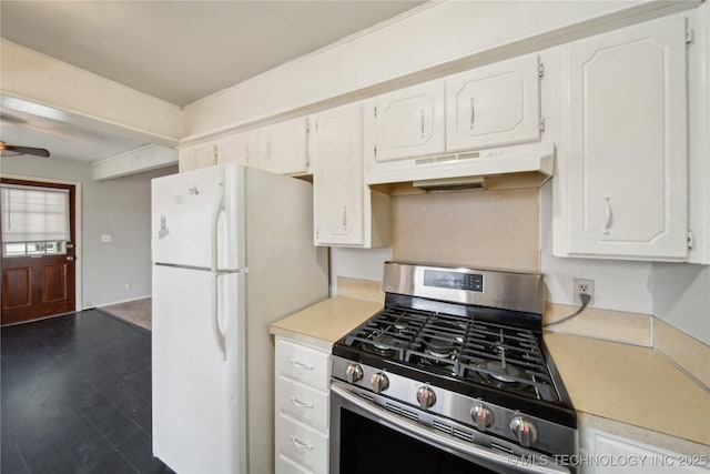 kitchen featuring ceiling fan, stainless steel range with gas cooktop, white fridge, white cabinetry, and dark hardwood / wood-style floors