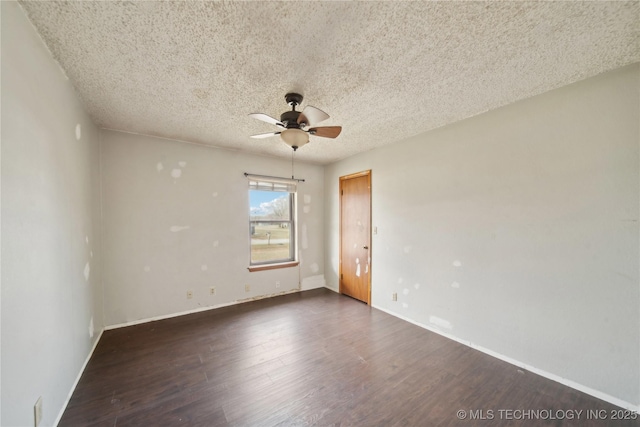 unfurnished room featuring a textured ceiling, dark wood-type flooring, and ceiling fan