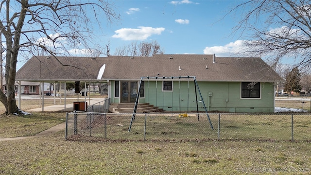 back of property featuring a lawn