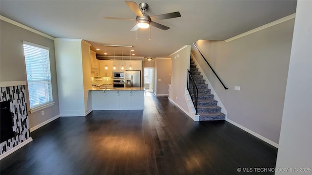 unfurnished living room with crown molding, dark hardwood / wood-style floors, and ceiling fan