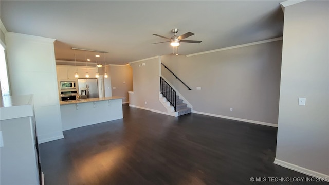 unfurnished living room with ceiling fan, ornamental molding, and dark hardwood / wood-style flooring