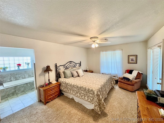 3 Huntly, Burneyville, OK 73430 - bedroom featuring a ceiling fan, a textured ceiling, light colored carpet, and multiple windows