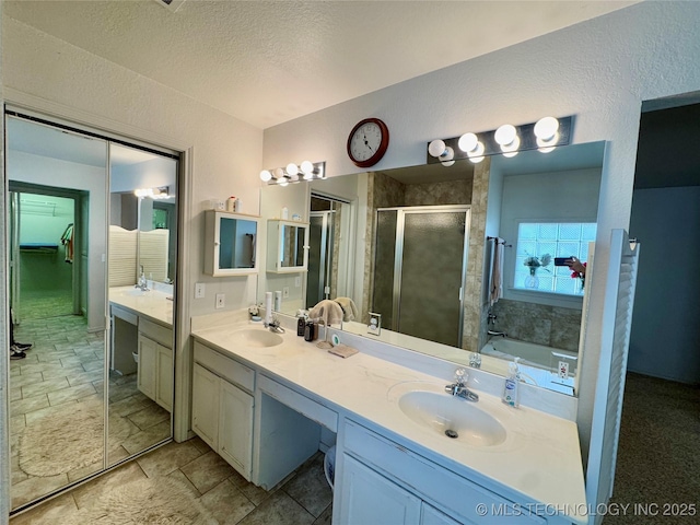 3 Huntly, Burneyville, OK 73430 - bathroom with a sink, a textured ceiling, double vanity, a stall shower, and a garden tub
