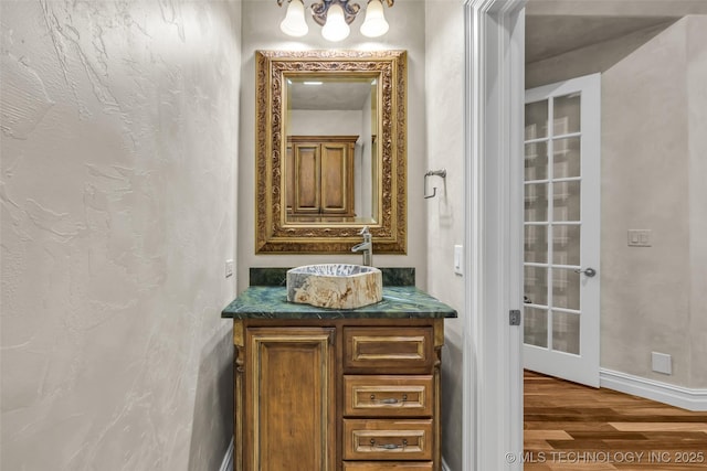 bathroom with vanity and hardwood / wood-style floors