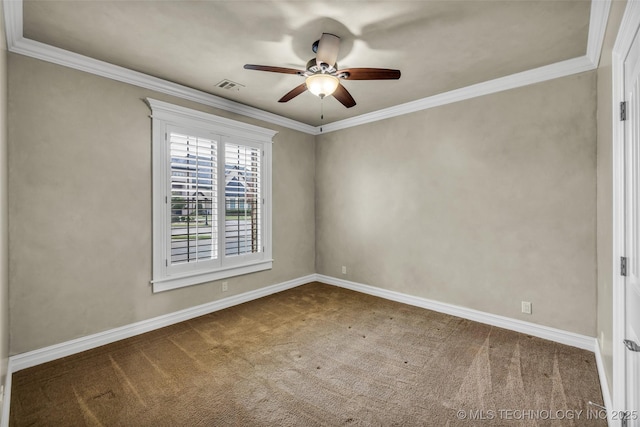 empty room with ornamental molding, ceiling fan, and carpet flooring