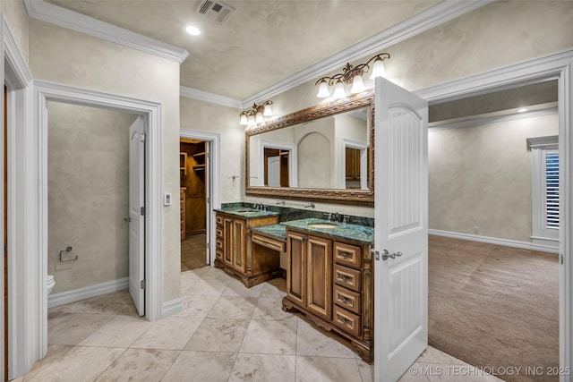 bathroom featuring vanity, crown molding, and toilet