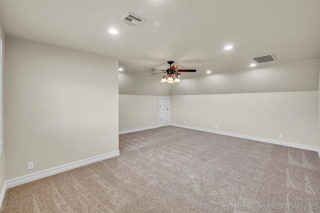 spare room featuring ceiling fan, lofted ceiling, and carpet floors