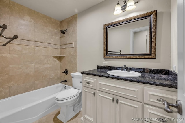 full bathroom with tiled shower / bath, vanity, and toilet