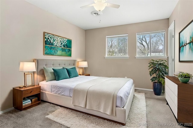 bedroom featuring light carpet and ceiling fan