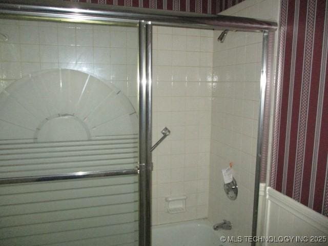 bathroom featuring tiled shower / bath combo