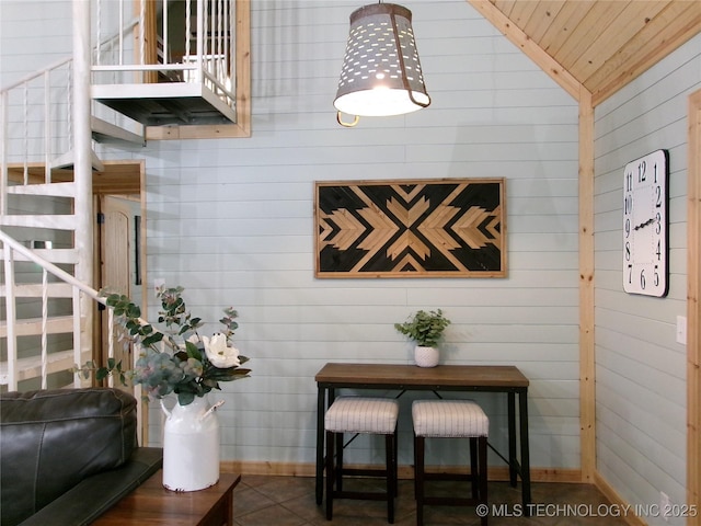 interior space featuring lofted ceiling and wooden ceiling