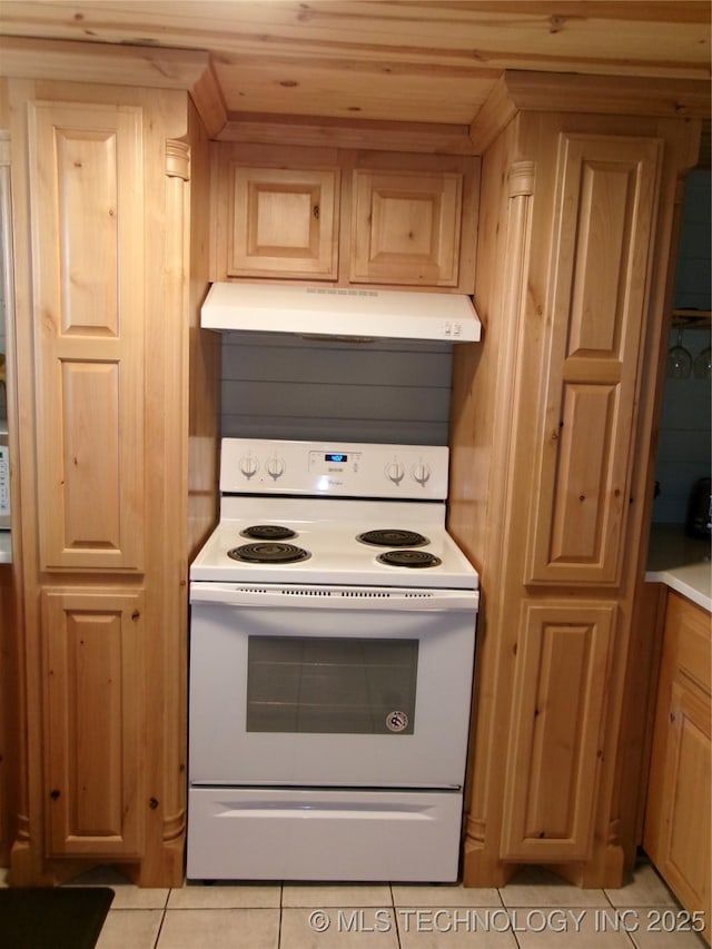 kitchen featuring wooden ceiling, light tile patterned floors, and white range with electric stovetop