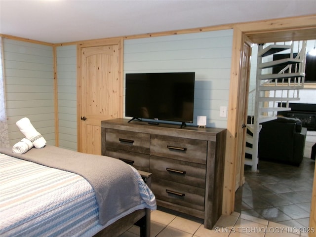 bedroom with light tile patterned flooring