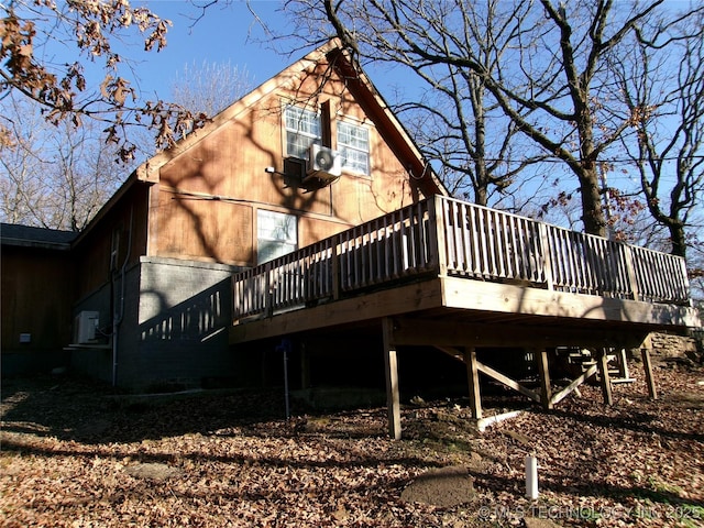 back of property featuring a deck