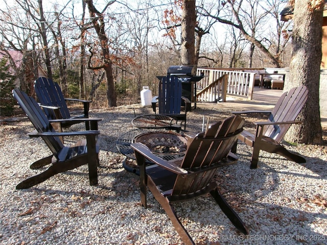 view of patio with a fire pit