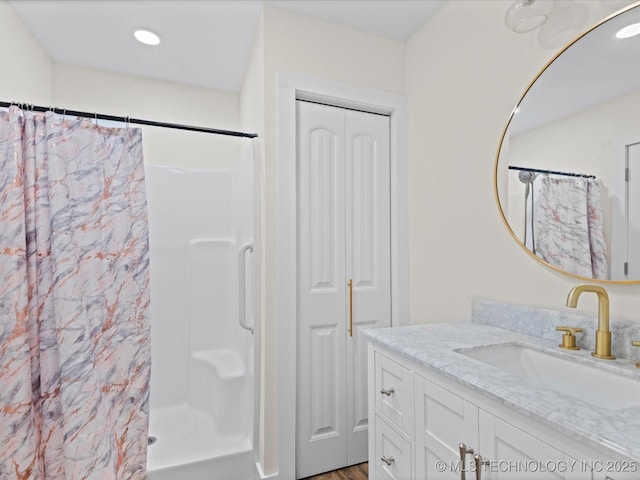 bathroom with vanity and a shower with shower curtain